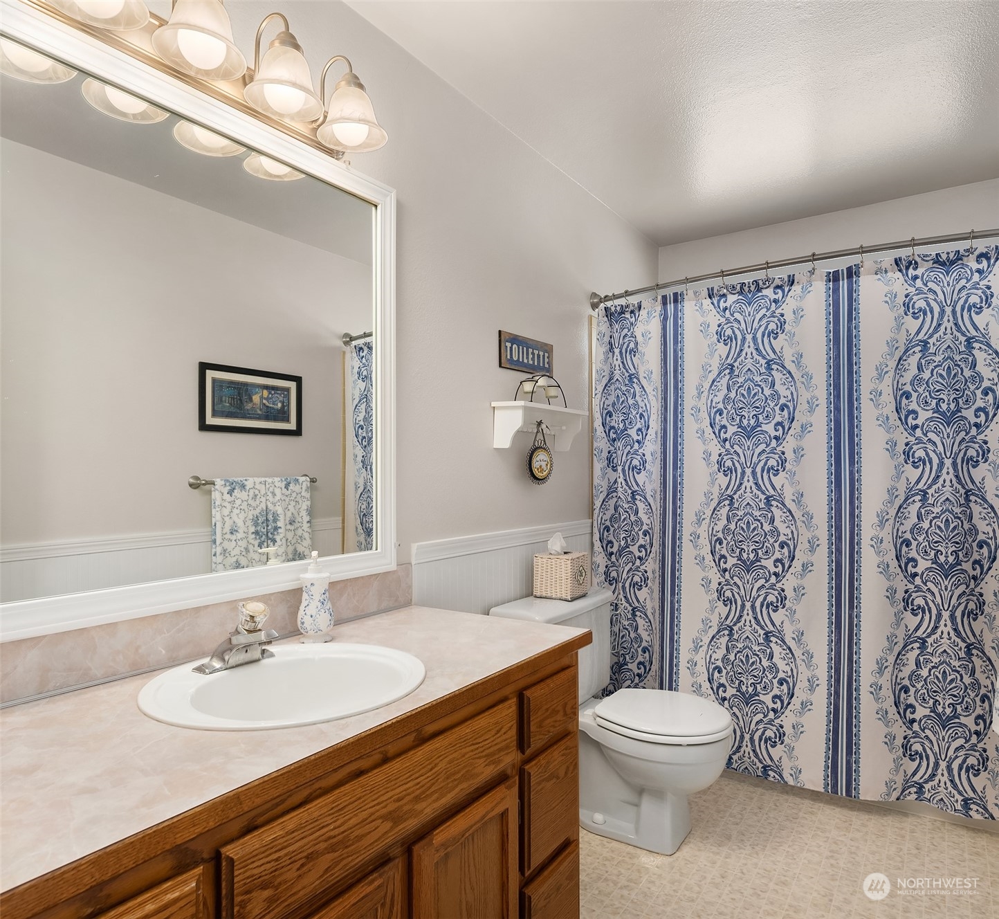 23017 38th Avenue Southeast Bothell, WA 98021 - Photo 18 of 38 a bathroom with a sink a toilet and shower
