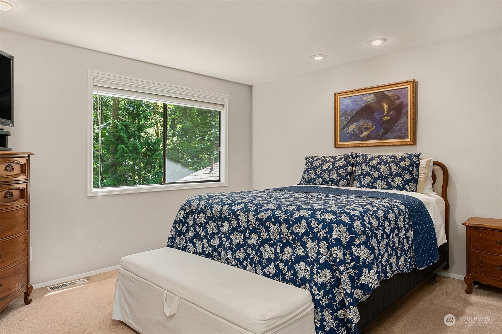23017 38th Avenue Southeast Bothell, WA 98021 - Photo 19 of 38 a bedroom with a bed and a painting on the wall