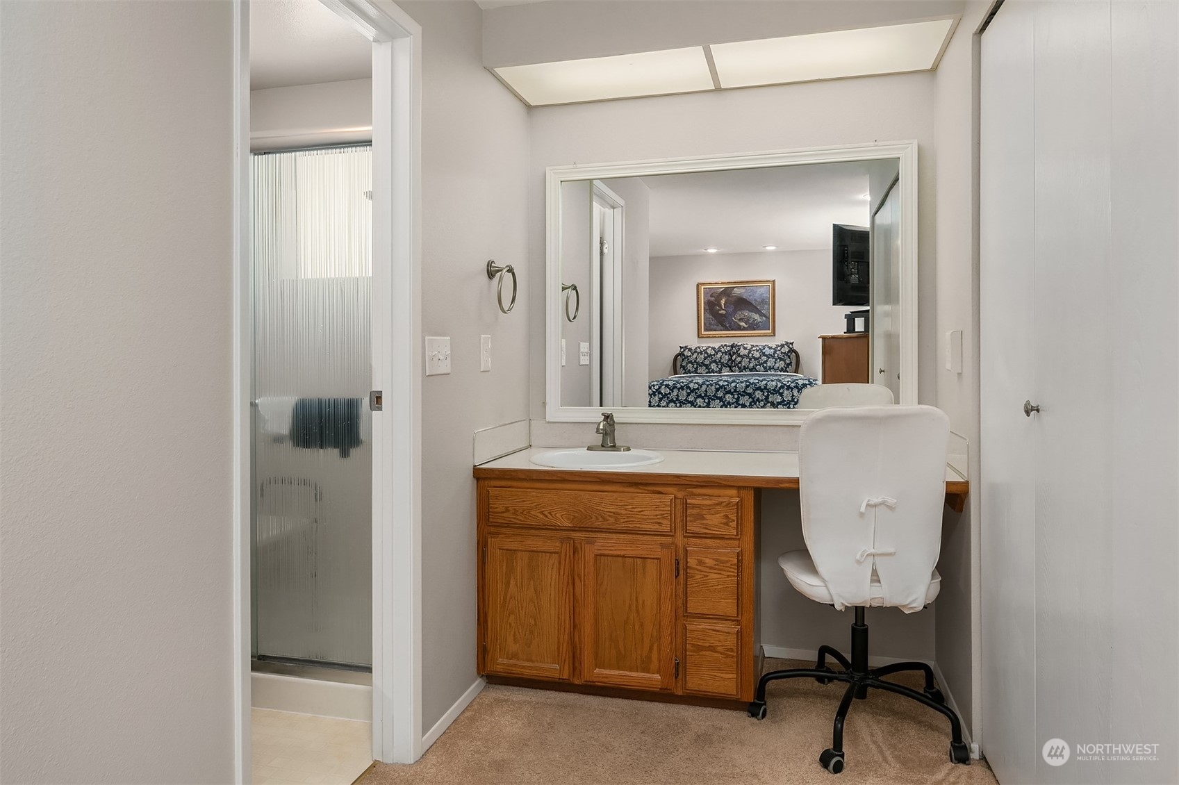 23017 38th Avenue Southeast Bothell, WA 98021 - Photo 21 of 38 a en suite bathroom with a granite countertop sink and a mirror