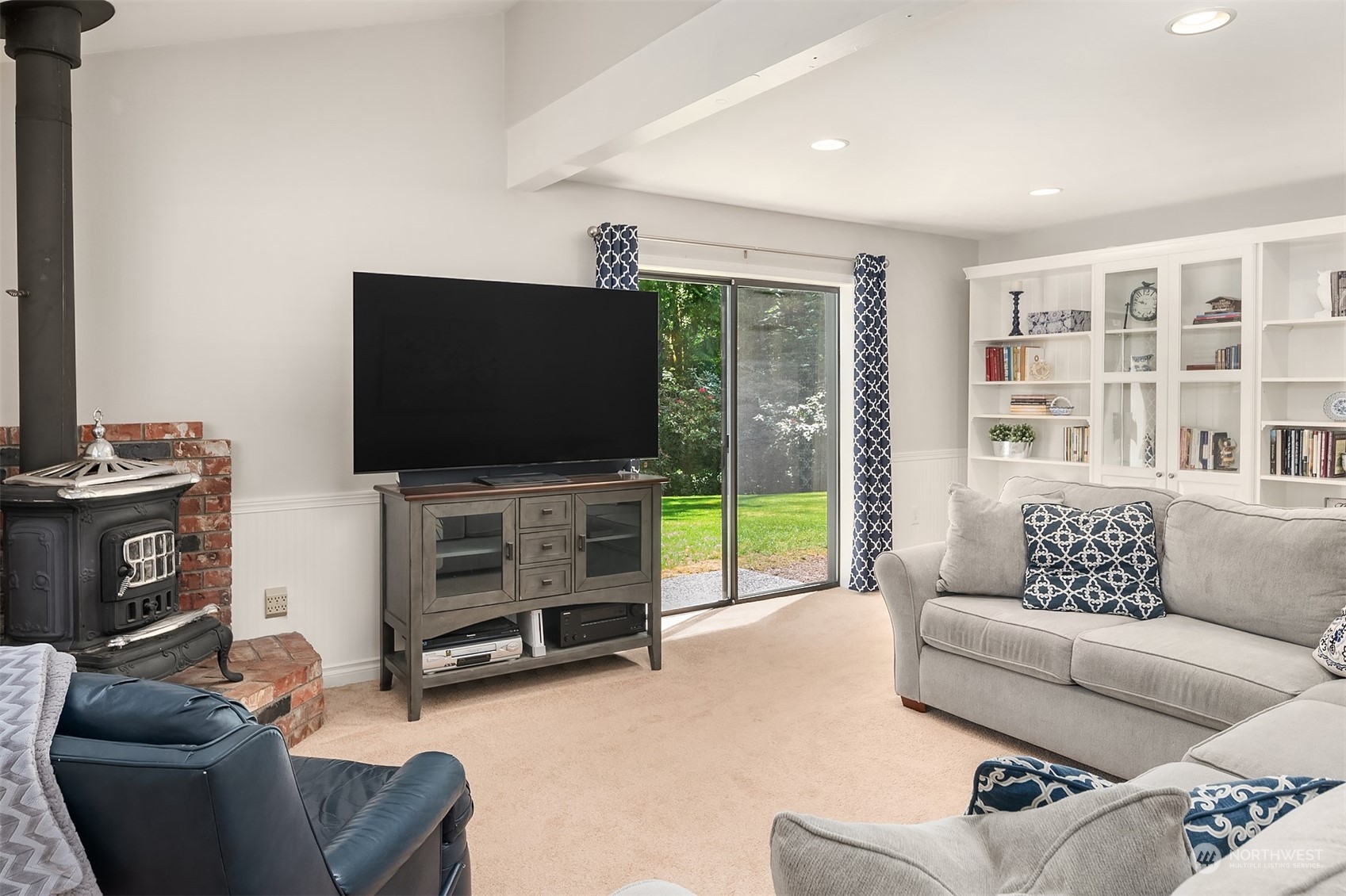 23017 38th Avenue Southeast Bothell, WA 98021 - Photo 22 of 38 a living room with furniture and a flat screen tv