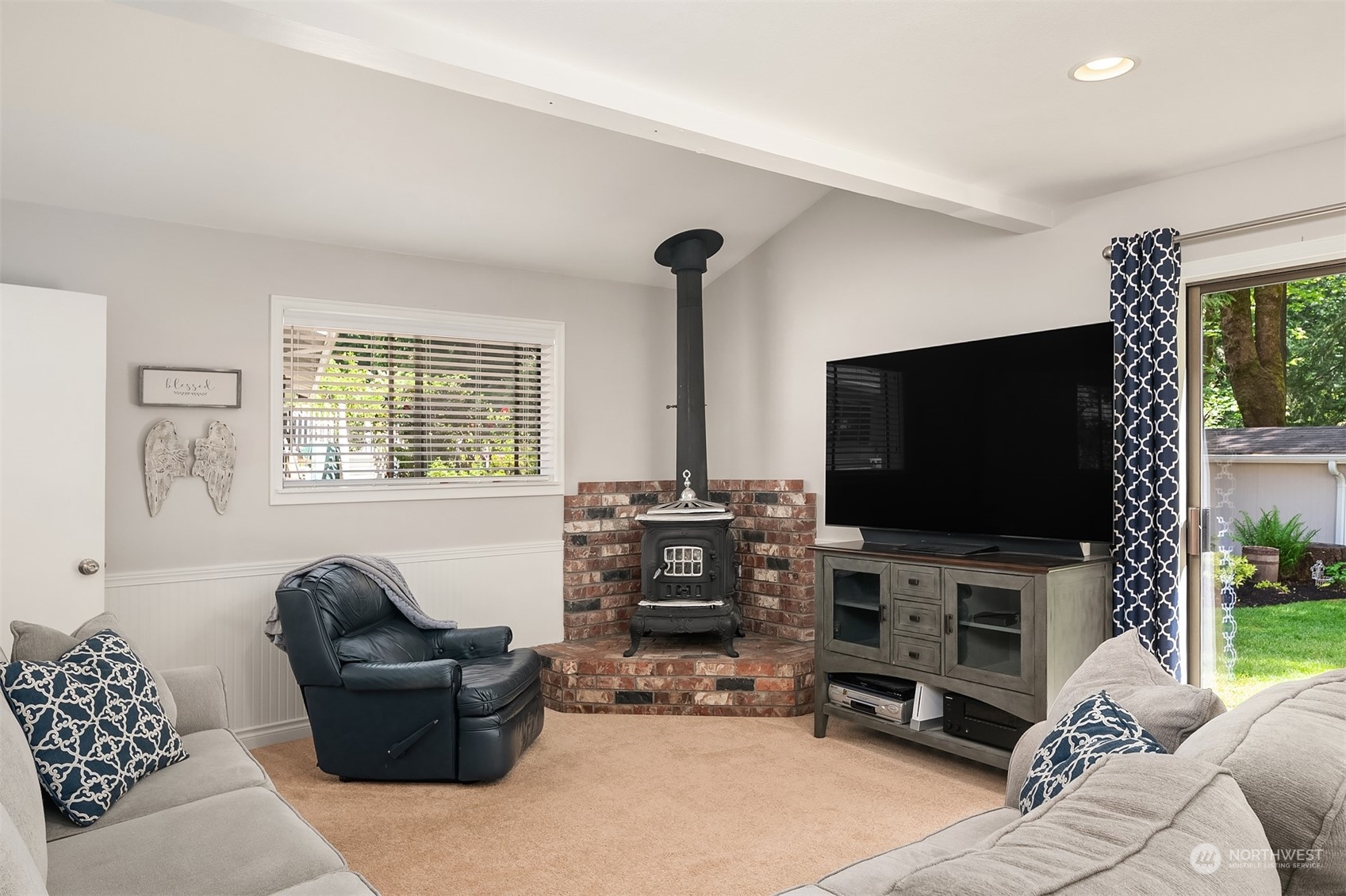 23017 38th Avenue Southeast Bothell, WA 98021 - Photo 23 of 38 a living room with furniture and a flat screen tv