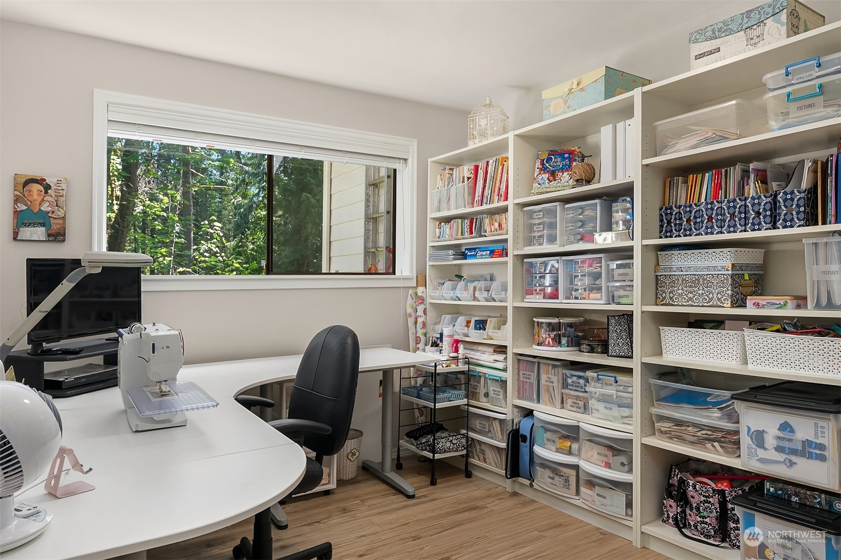 23017 38th Avenue Southeast Bothell, WA 98021 - Photo 25 of 38 a work room with furniture and a book shelf