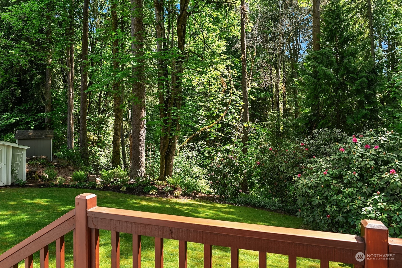 23017 38th Avenue Southeast Bothell, WA 98021 - Photo 33 of 38 a view of a wooden fence and trees in the background