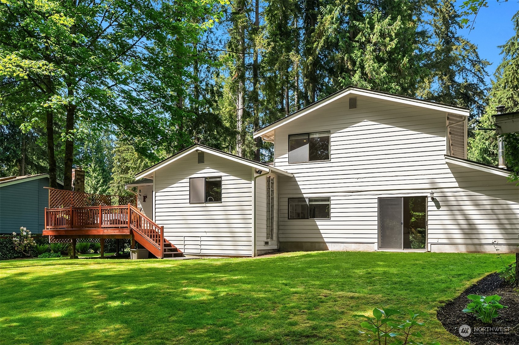 23017 38th Avenue Southeast Bothell, WA 98021 - Photo 35 of 38 a front view of a house with a garden