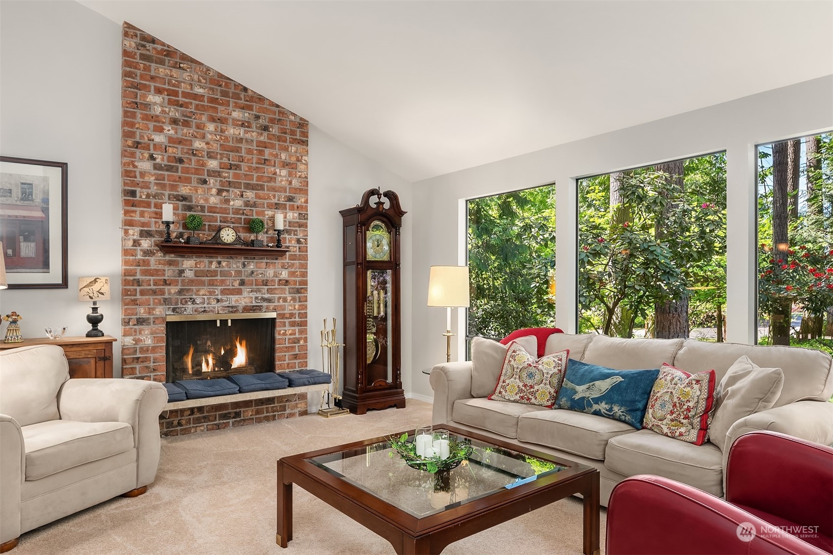 23017 38th Avenue Southeast Bothell, WA 98021 - Photo 4 of 38 a living room with furniture a large window and a fireplace