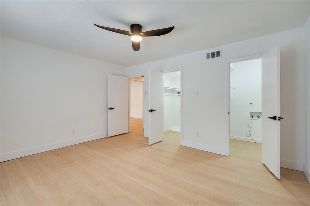 4664 Matilda Street, Unit F Dallas, TX 75206 - Photo 10 of 13 Unfurnished bedroom with a spacious closet, light wood-type flooring, and ceiling fan