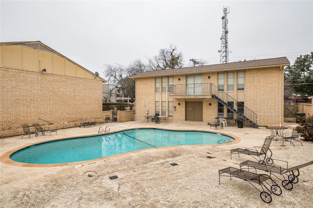 4664 Matilda Street, Unit F Dallas, TX 75206 - Photo 12 of 13 Community pool with a patio area, stairs, and a balcony