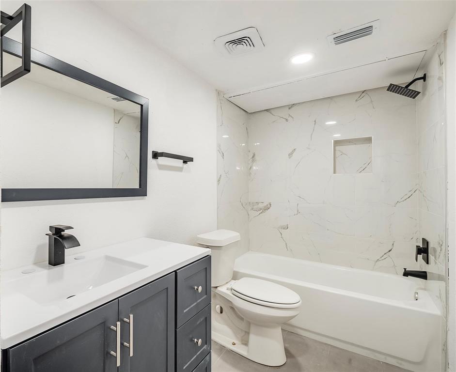 4664 Matilda Street, Unit F Dallas, TX 75206 - Photo 1 of 13 Full bathroom featuring vanity, shower / bath combination, and recessed lighting