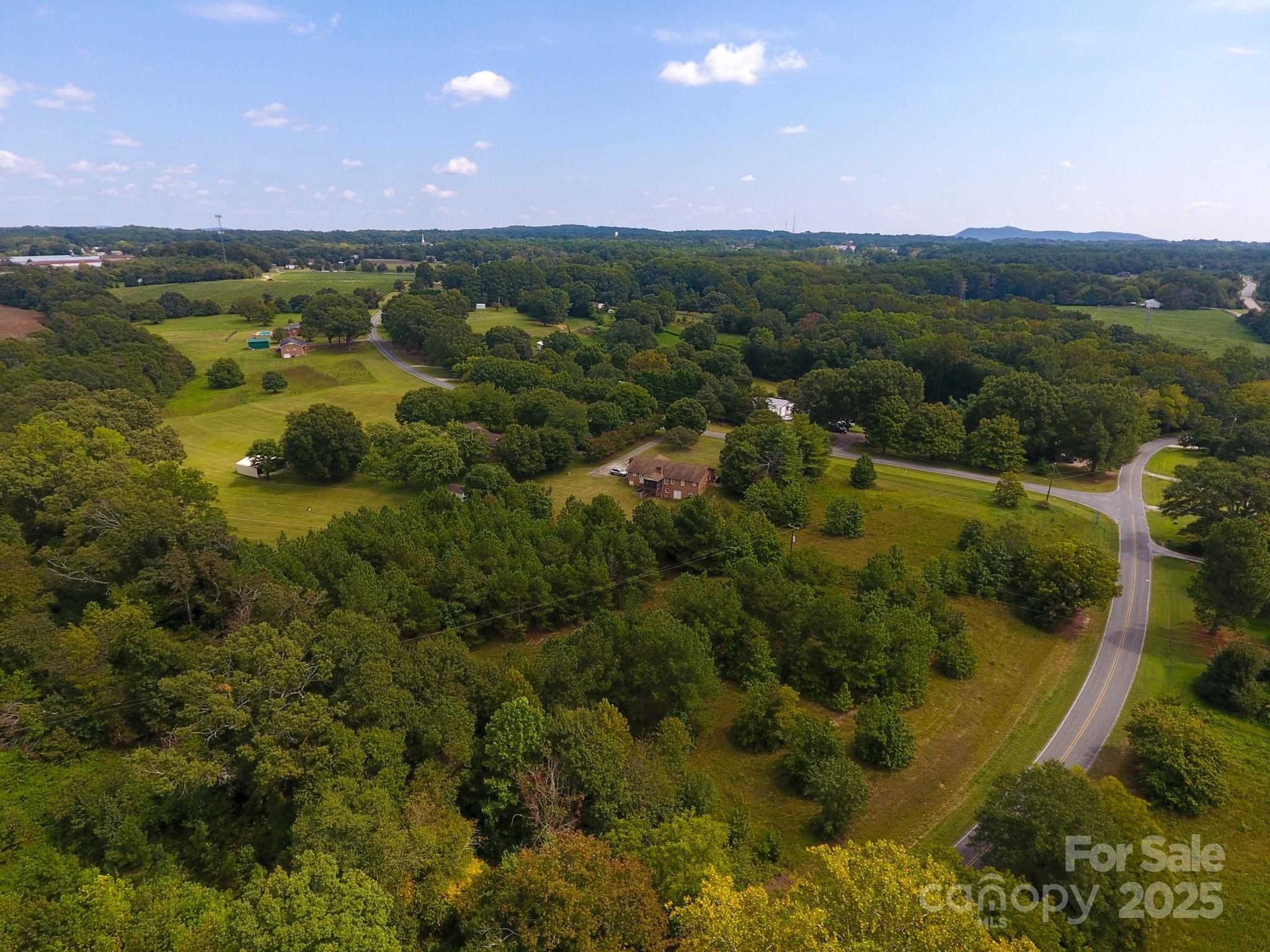 0 Putnam Lake Road Kings Mountain, NC 28086 - Photo 11 of 13 a view of a city with lush green forest