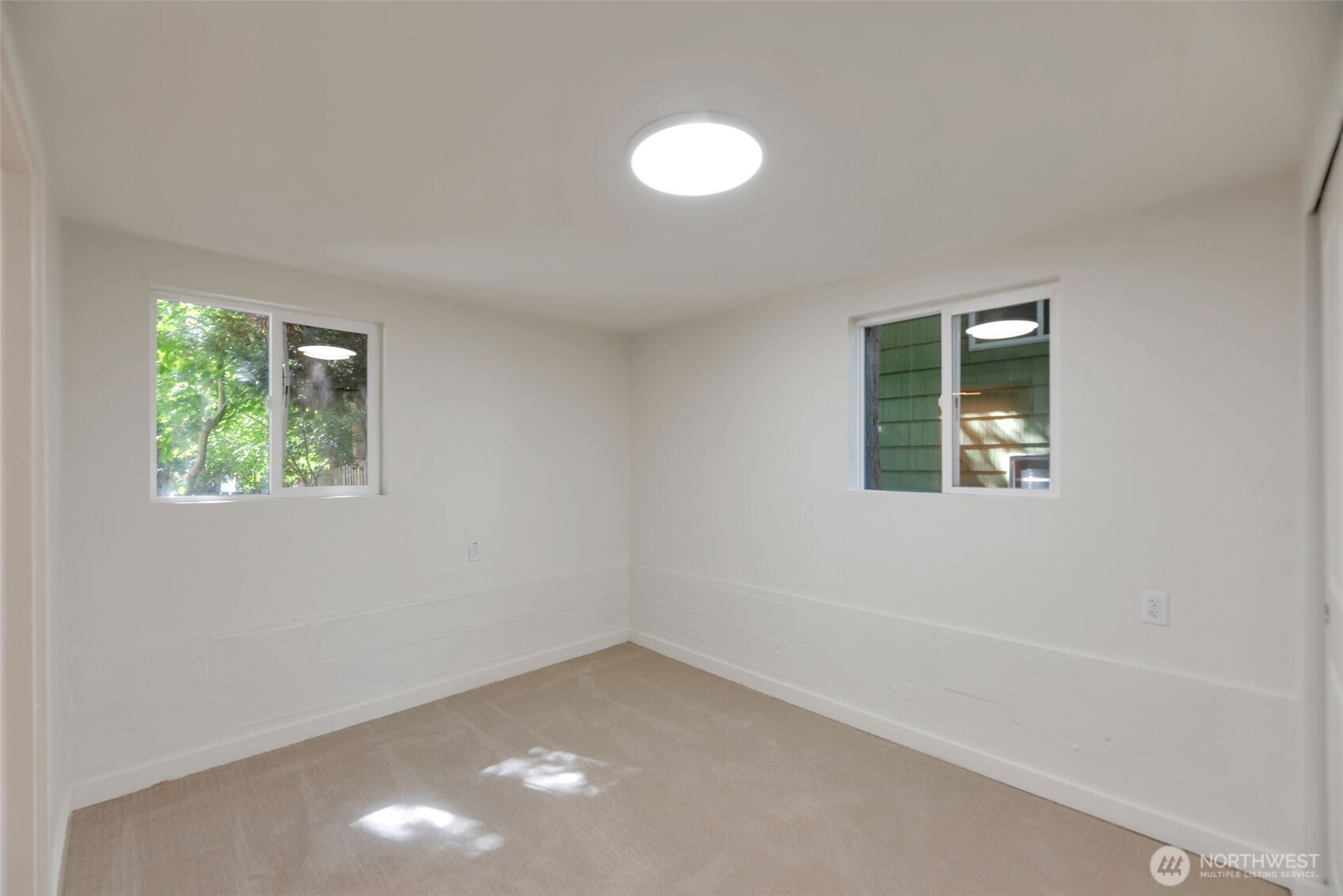 11229 29th Avenue Southwest Seattle, WA 98146 - Photo 21 of 28 an empty room with a window