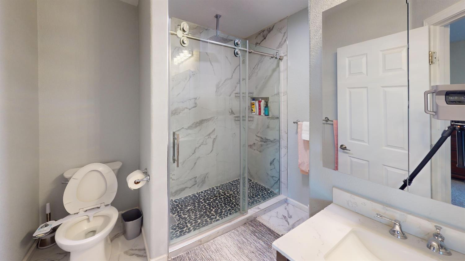 4057 Dale Road, Unit B Modesto, CA 95356 - Photo 16 of 39 a bathroom with a shower toilet and sink