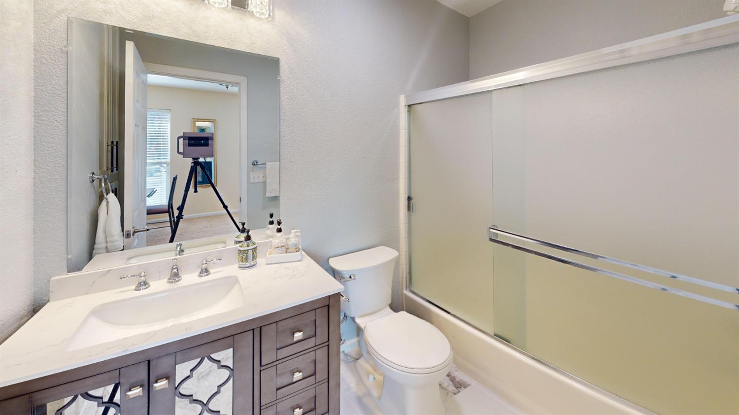 4057 Dale Road, Unit B Modesto, CA 95356 - Photo 22 of 39 a bathroom with a sink toilet and shower