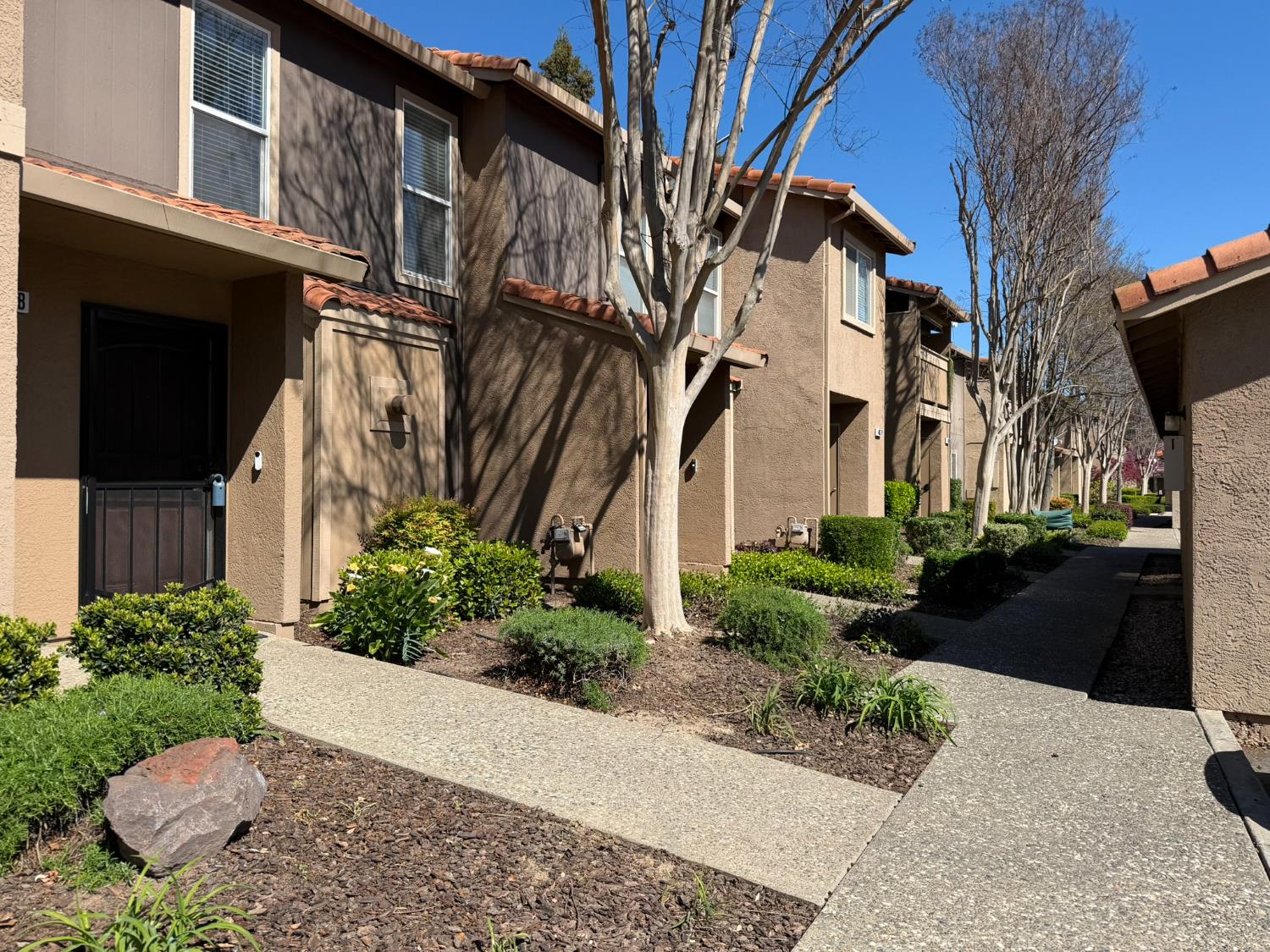 4057 Dale Road, Unit B Modesto, CA 95356 - Photo 34 of 39 a view of a pathway with a house in the background