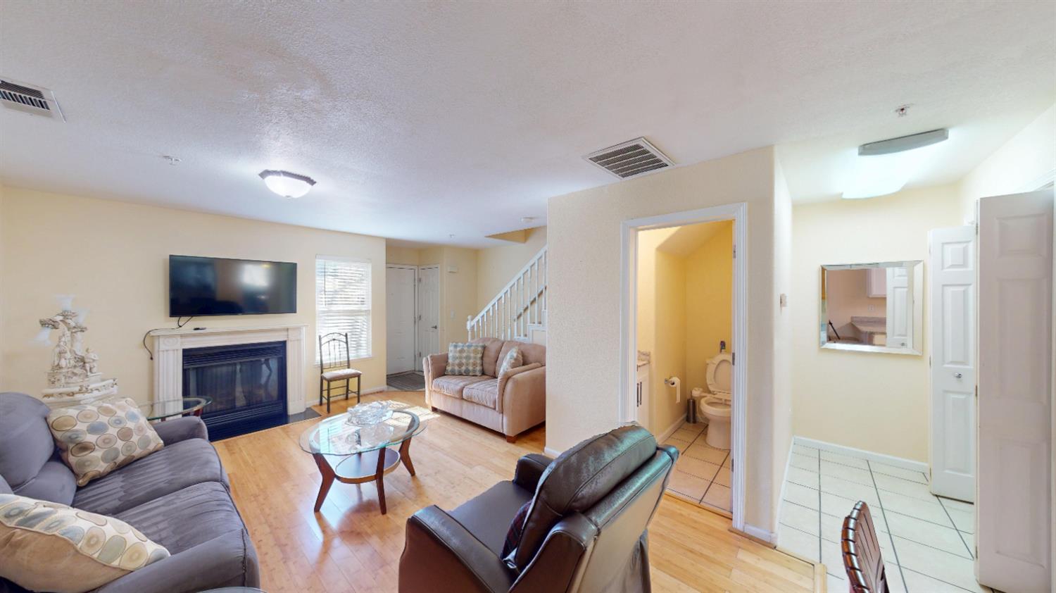 4057 Dale Road, Unit B Modesto, CA 95356 - Photo 5 of 39 a living room with furniture a flat screen tv and a fireplace