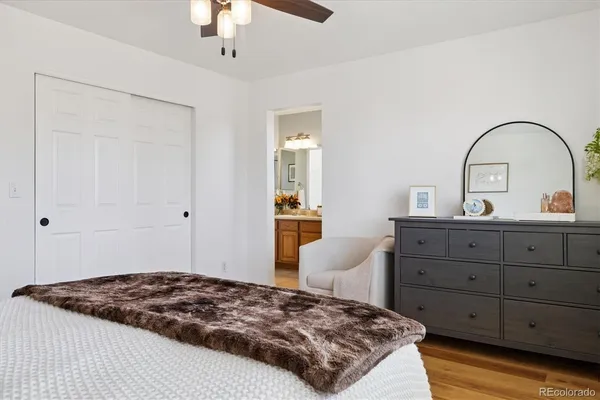 a bedroom with a bed and a dresser