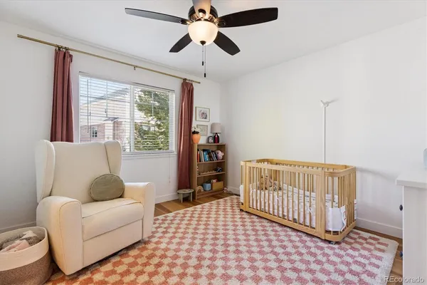 a bedroom with furniture and a window