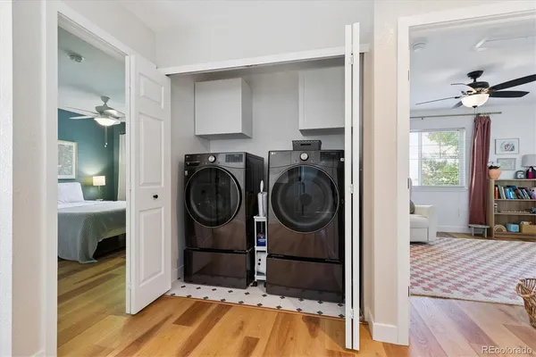 a view of a bedroom with washer and dryer
