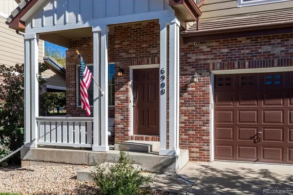 a front view of a house with a porch