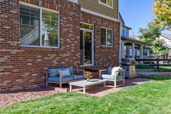 a wooden bench sitting in front of a house