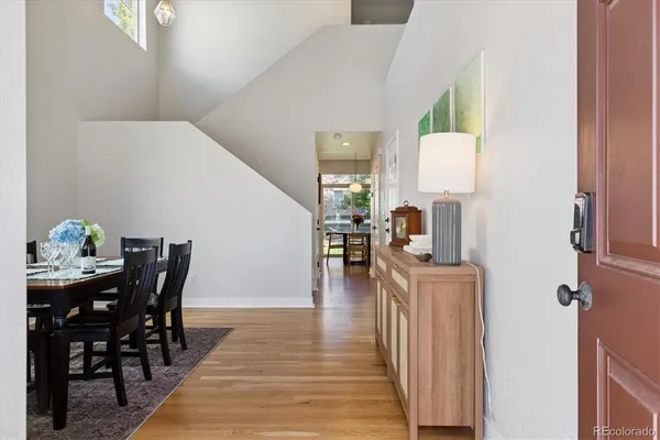 a view of a dining room with furniture and wooden floor