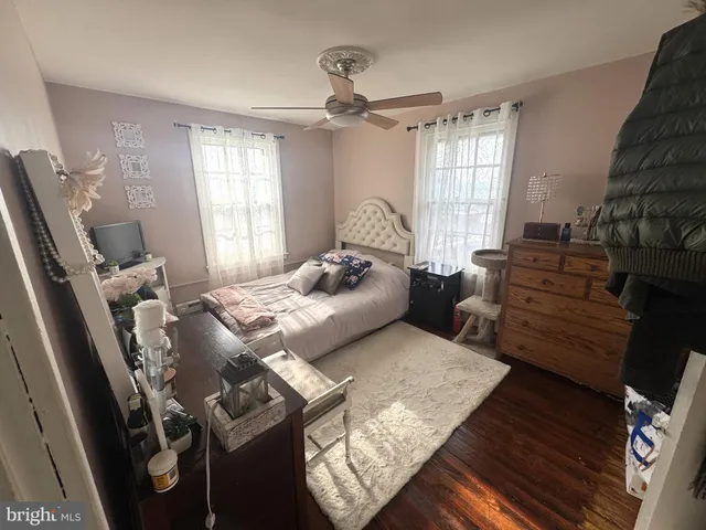 a bedroom with furniture and a window