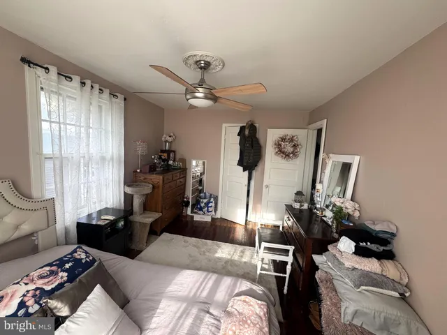 a bedroom with furniture and a window