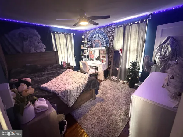 a bedroom with a bed and a mirror