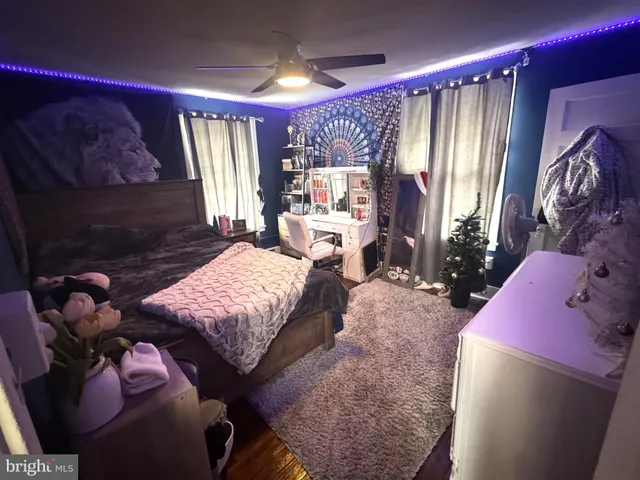 a bedroom with a bed and a mirror