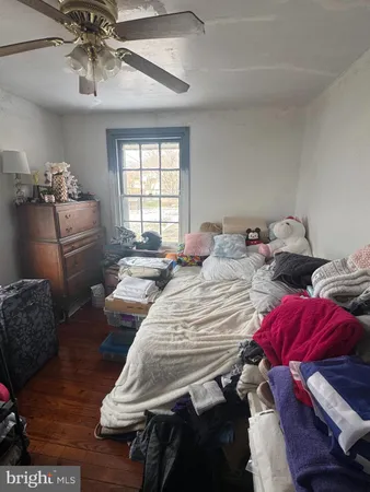 a bedroom with two beds and a chandelier