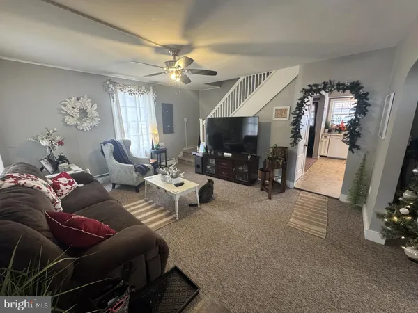 a living room with furniture and a flat screen tv