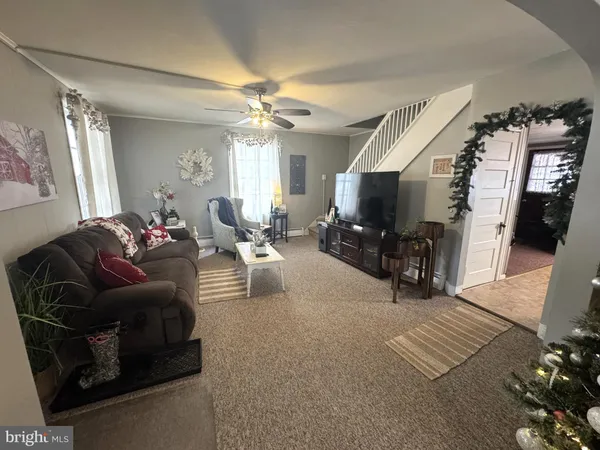 a living room with furniture and a flat screen tv