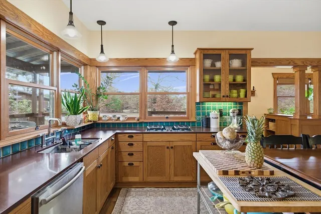 a kitchen with large windows