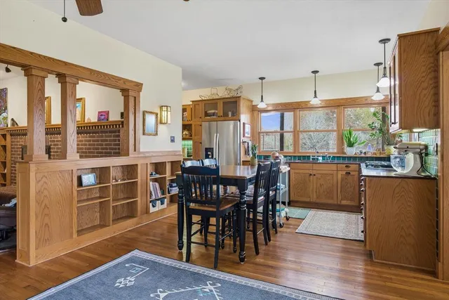 a view of a dining room with furniture window and wooden floor