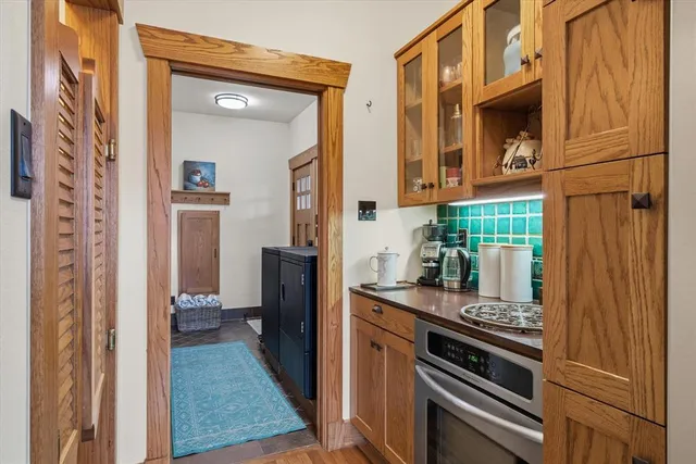 a kitchen with a refrigerator and a stove