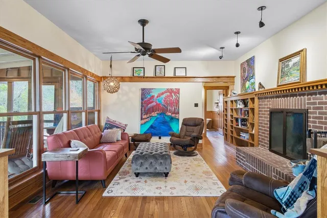 a living room with furniture fireplace and flat screen tv