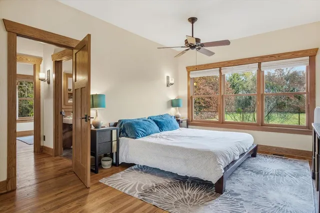 a bedroom with a large bed and a window