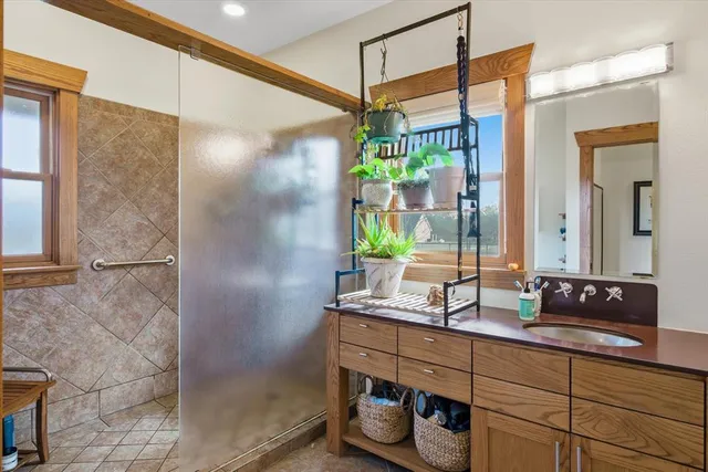 a bathroom with a double vanity sink and a mirror