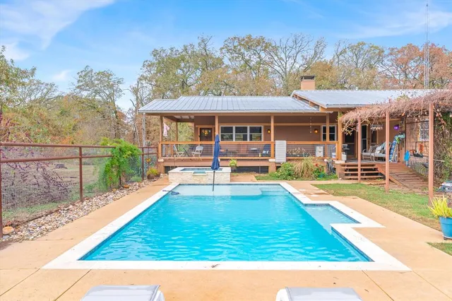 a view of a house with a swimming pool