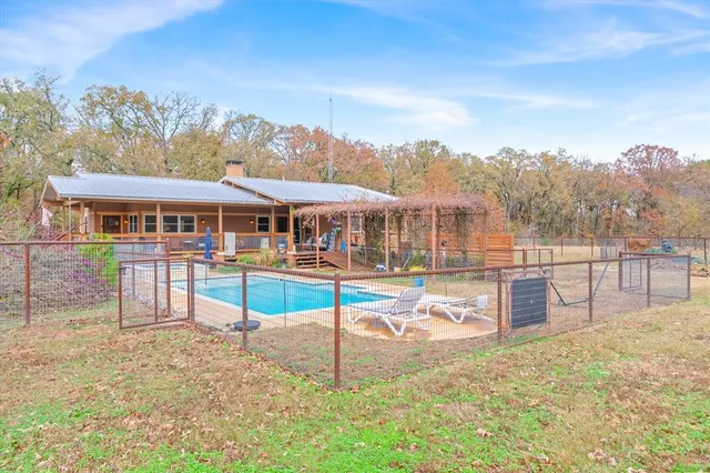 aerial view of a house with a swimming pool