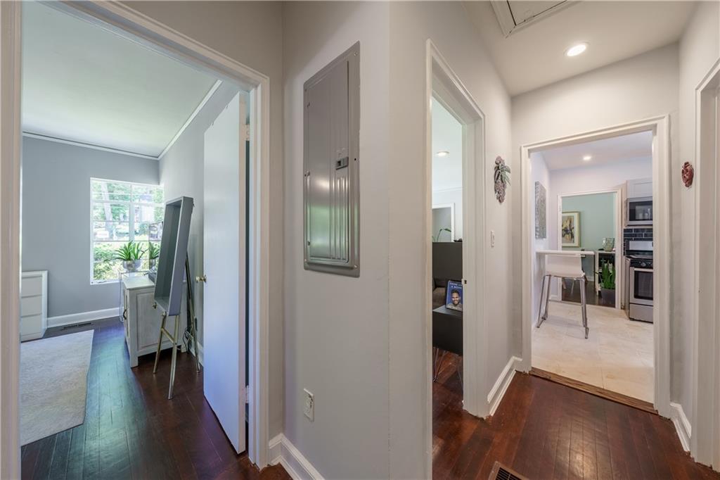 1920 West Forrest Avenue Atlanta, GA 30344 - Photo 15 of 28 a view of a hallway with wooden floor and a living room