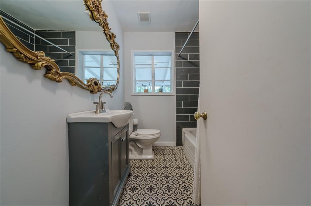 1920 West Forrest Avenue Atlanta, GA 30344 - Photo 18 of 28 a bathroom with a sink toilet and shower