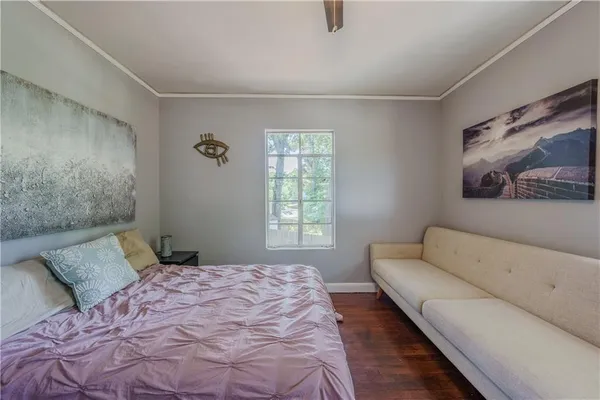 a bedroom with a bed and a couch