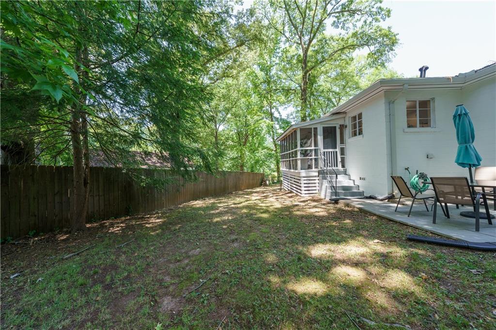 1920 West Forrest Avenue Atlanta, GA 30344 - Photo 24 of 28 a backyard of a house with yard and outdoor seating