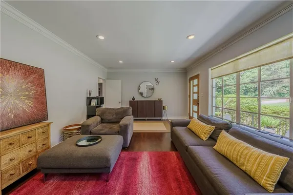 a living room with furniture and a large window
