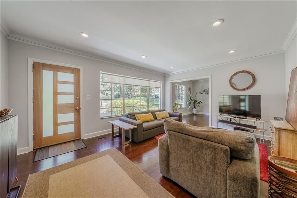 1920 West Forrest Avenue Atlanta, GA 30344 - Photo 4 of 28 a living room with furniture and a flat screen tv
