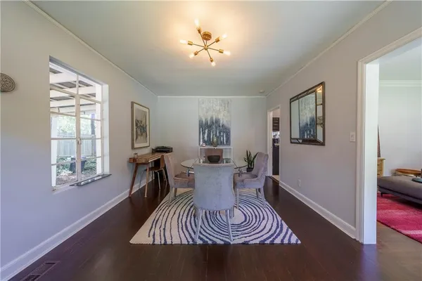 a view of a livingroom with furniture window and wooden floor