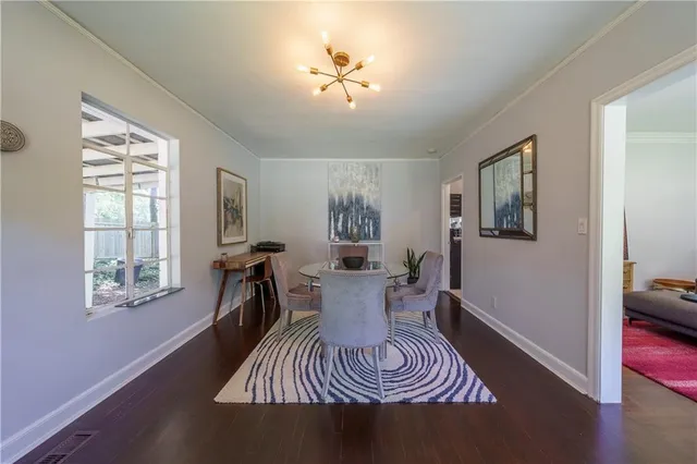 a view of a livingroom with furniture window and wooden floor