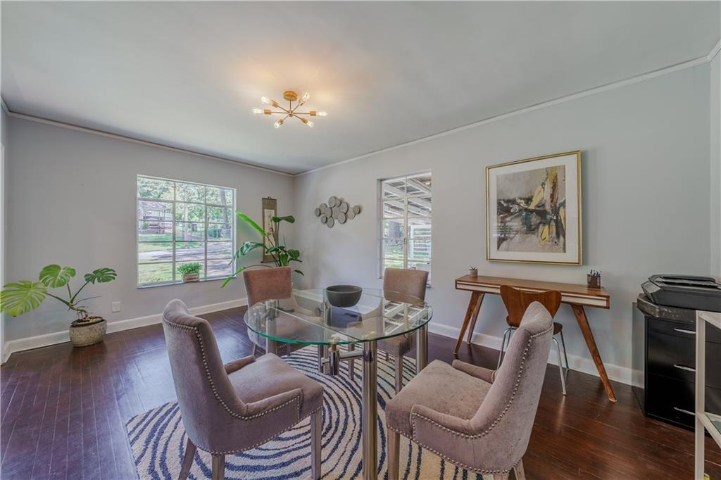 1920 West Forrest Avenue Atlanta, GA 30344 - Photo 8 of 28 a view of a dining room with furniture window and wooden floor