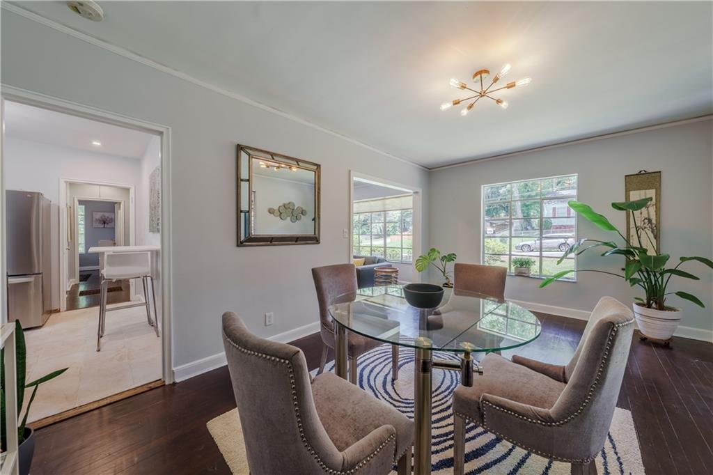 1920 West Forrest Avenue Atlanta, GA 30344 - Photo 9 of 28 a view of a dining room with furniture window and wooden floor