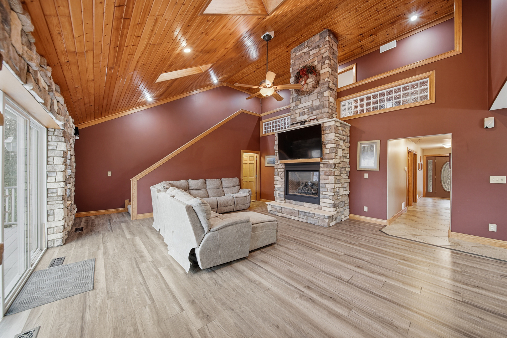 7231 South Lost Nation Road Dixon, IL 61021 - Photo 12 of 39 a view of a porch with furniture and a fireplace